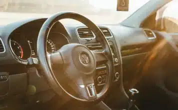 sunlight piercing through Volkswagen steering wheel